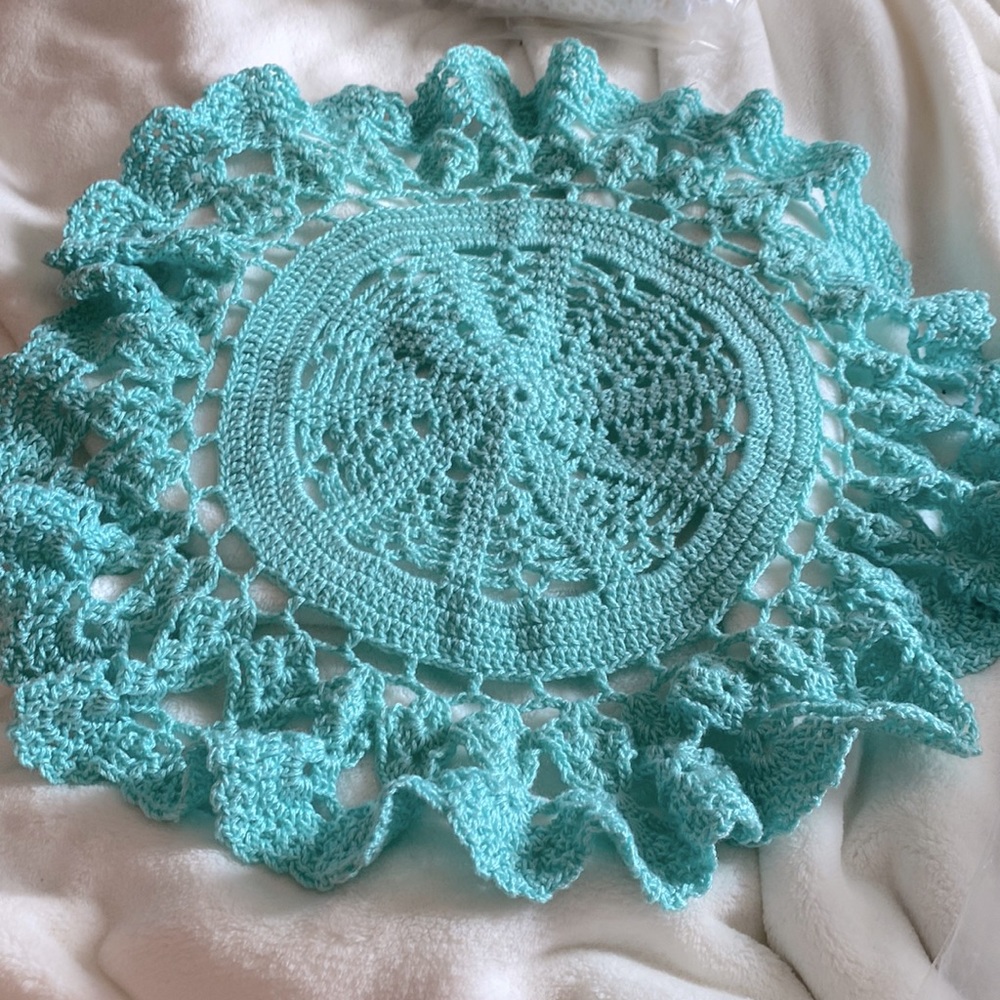 18” round aqua crochet table topper. Not sure if it’s handmade or not but pretty